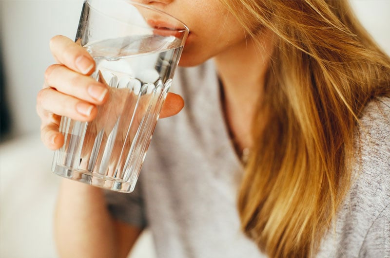 woman drinking glass of water