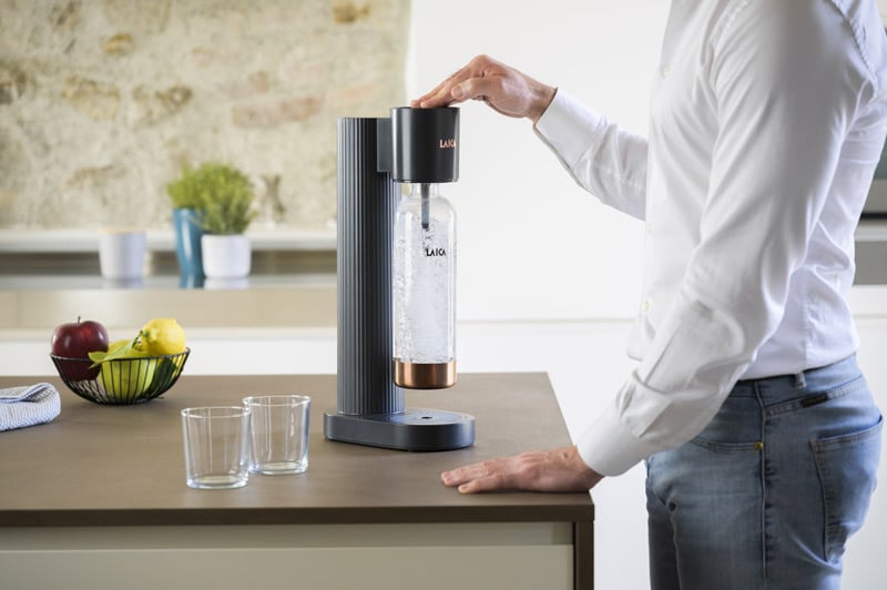 LAICA sparkling water maker with a man