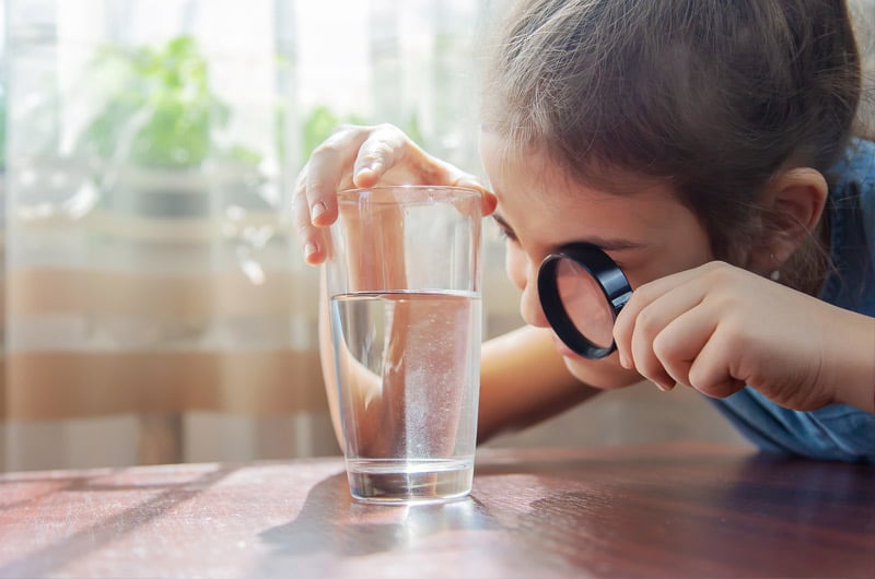 child with a glass of water