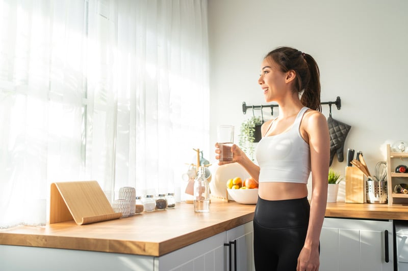 woman-drinks-water-smiling